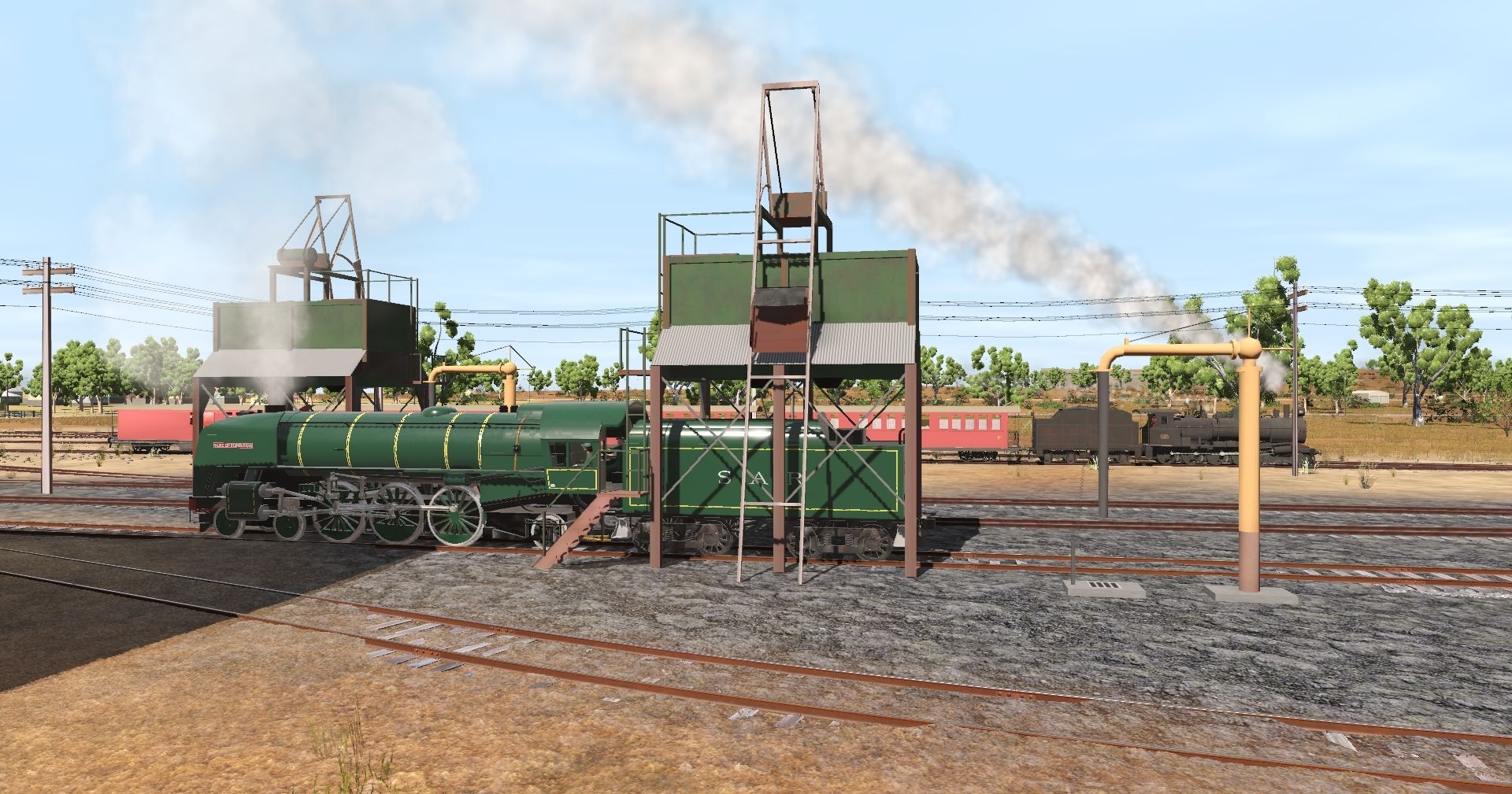 Broad-gauge-SAR-621-takes-coal-and-water-at-Terowie-depot-while-narrow-gauge-T-197-leads-a-Peterborough-bound-service.jpg