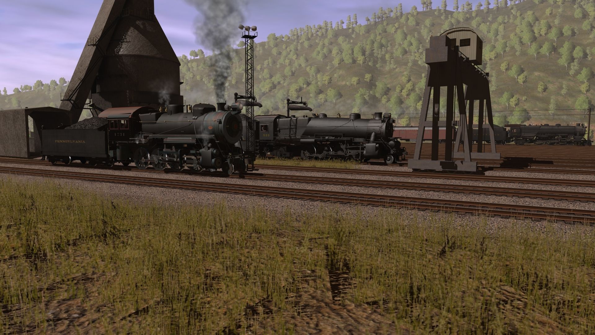 An-H9-and-a-L1-wait-for-assignments-as-a-PRR-K4-leads-a-train-east..jpg