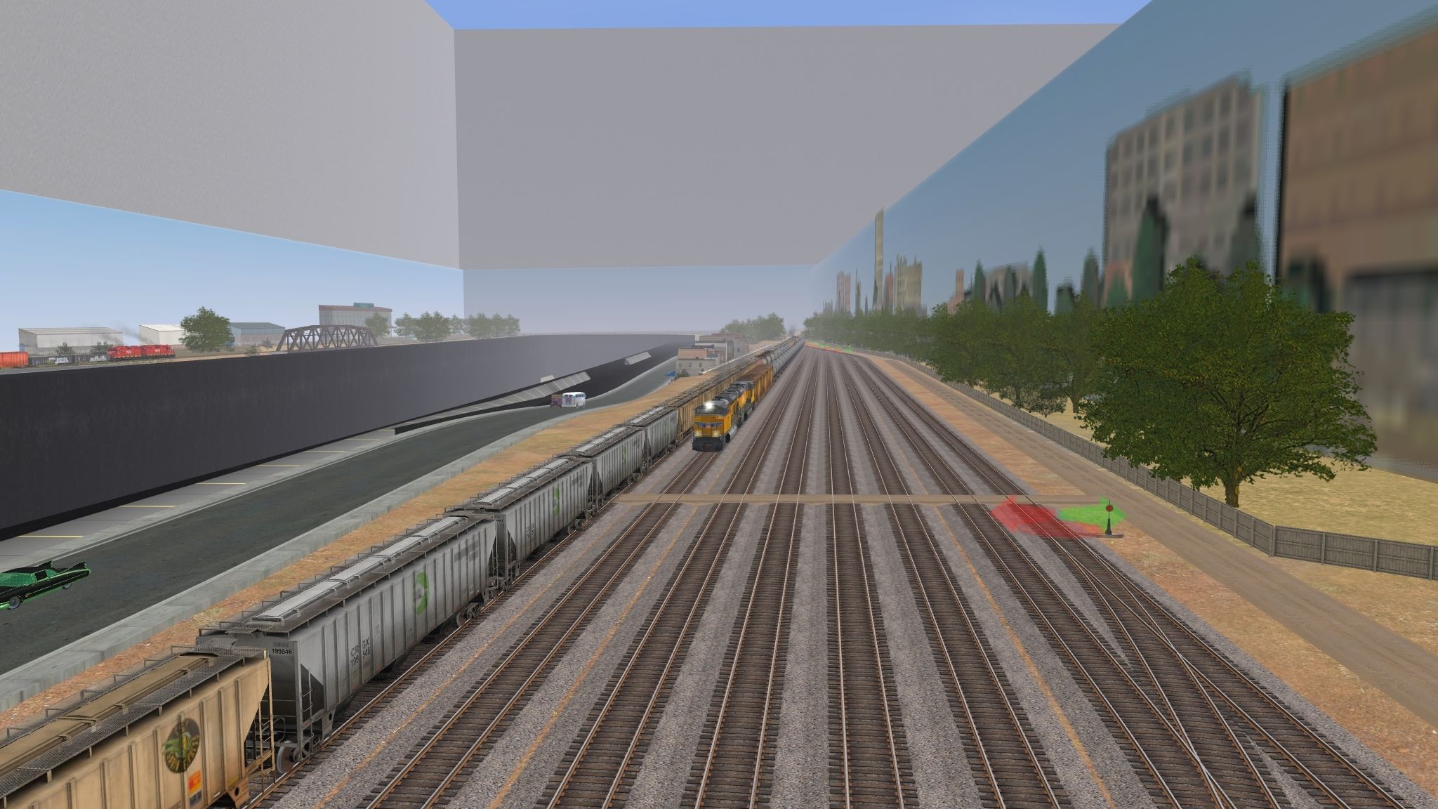 A-southbound-unit-oil-train-passes-a-stopped-grain-train-at-Plains-City-Yard.-The-Plains-City-local-%28back-left%29-will-follow-it-into-the-yard.jpg