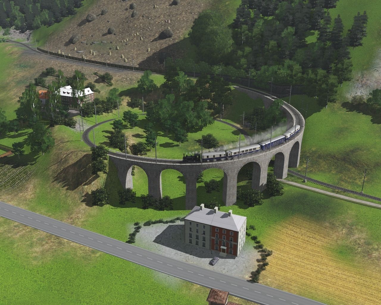 RhB-Thusis-with-a-train-at-the-Brusio-spiral-viaduct.jpg