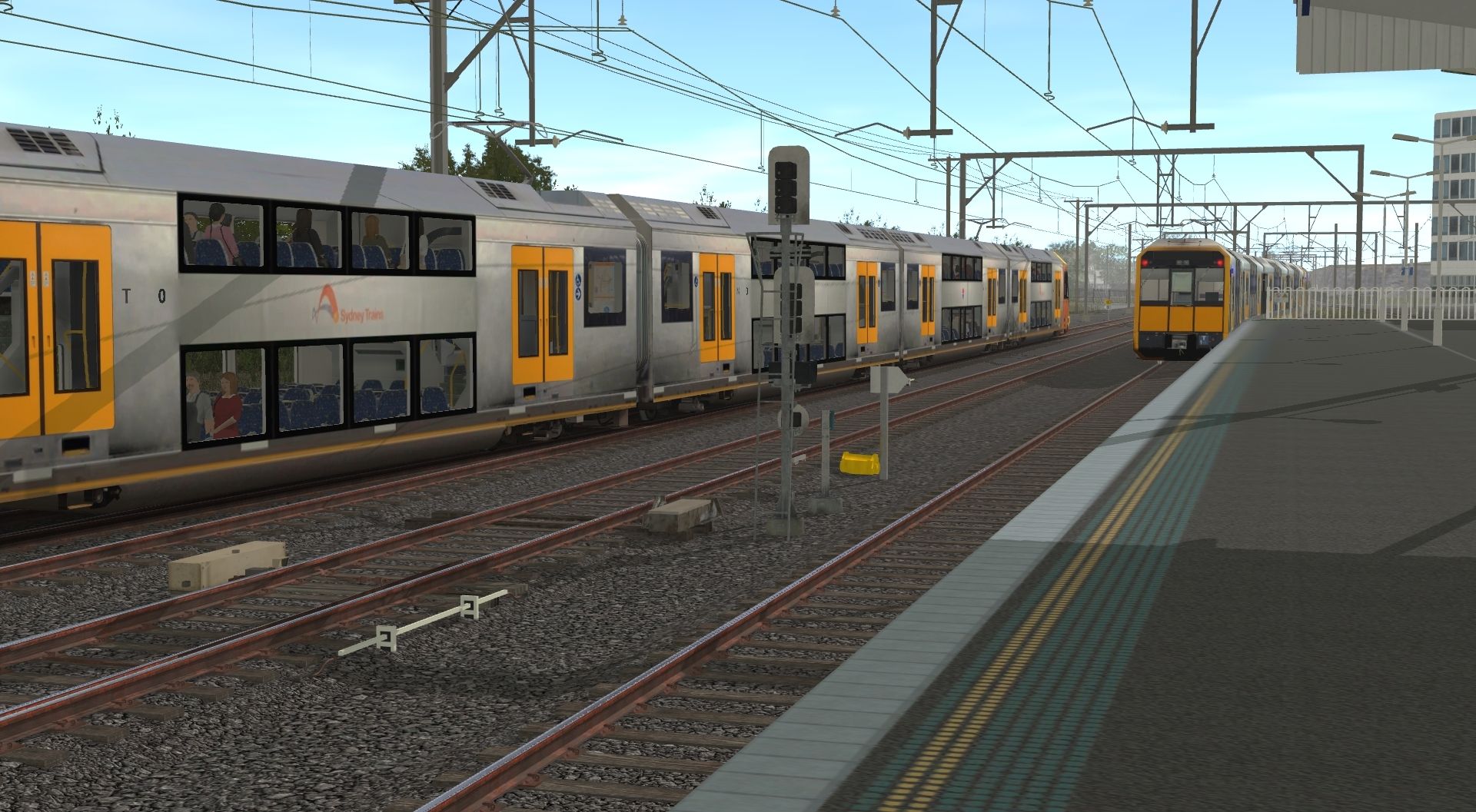 A-T-Set-departs-Wolli-Creek-as-a-city-bound-A-Set-joins-the-Up-Illawarra-Local-Line.jpg